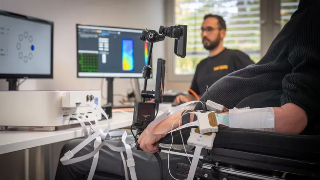 MIRMI researcher Ioannis Xygonakis measuring the muscle activity of a paraplegic's forearm.