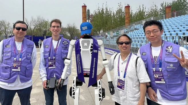 Team from the Technical University of Munich at the half marathon race for humanoid robots in Beijing: Dr Julio Rogelio Guadarrama Olivera, Simon Armleder, Prof. Gordon Cheng and Xiangyu Fu