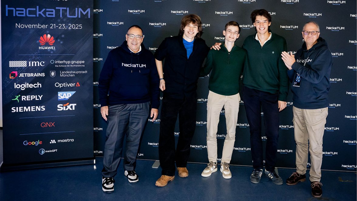 The winning team with the jury.